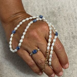 Beautiful pearl necklace and stretchy ring set from en route!! Blue, gold detail
